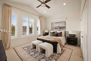 Bedroom with lofted ceiling, carpet floors, a ceiling fan, and recessed lighting