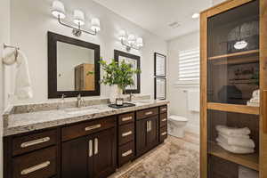Full bath with double vanity and recessed lighting
