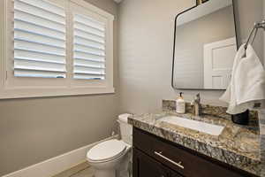 Bathroom with vanity and toilet