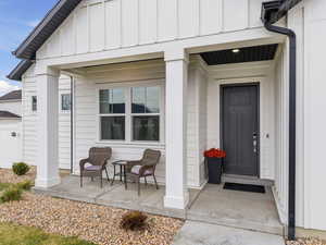View of exterior entry with board and batten siding