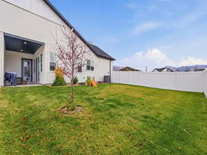 Fenced backyard featuring a patio