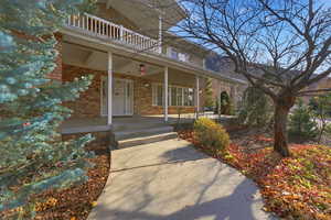 Inviting curved entry walkway framed by mature landscaping.