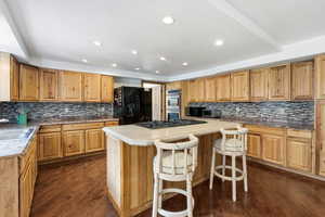 Beautiful wood cabinetry & backsplash.