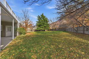 Fenced backyard featuring Covered Patio – Shaded SpaceYear-round outdoor living.