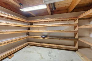Storage Room #1 – Built-In ShelvingFloor-to-ceiling wood racks.
