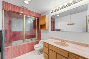 Basement Bathroom – Red Tile SuiteFull bath with vintage tile.