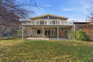 Rear Elevation – Full HouseBalcony, patio & full-width rear view.