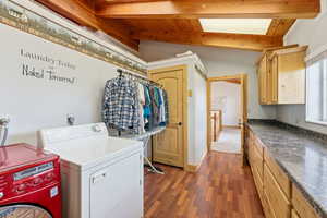 Connects to bedrooms & landing. Hanging rod & skylight. Laundry room #1