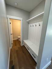 Mudroom featuring lockers and storage