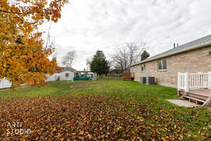 View of yard with a wooden deck