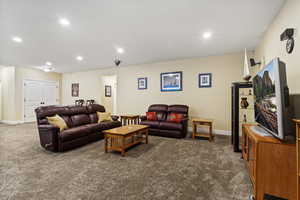 Family room area featuring carpet flooring and recessed lighting