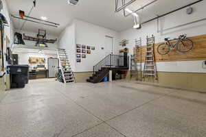 Garage with a garage door opener oversized with tandum 2 car on one side