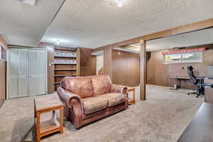 Basement area: living room, utilities/mechanical closet, laundry, and bathroom