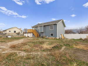 The white gate opens up with plenty of room for anything you need to put or build back here.