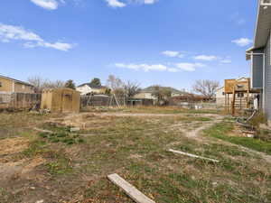 Fenced backyard and a shed