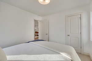Carpeted bedroom with baseboards