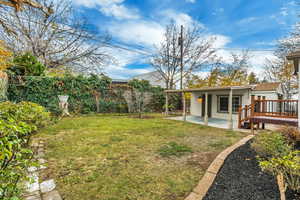 Fenced backyard with a patio area