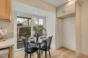 Dining room featuring light wood-style flooring and recessed lighting