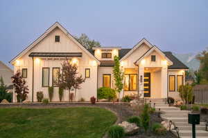 Modern farmhouse with board and batten siding, a standing seam roof, and a metal roof