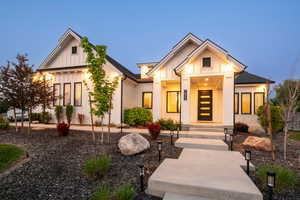 View of front of house featuring board and batten siding