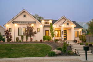 Modern farmhouse style home featuring board and batten siding and a standing seam roof