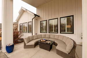 View of patio with an outdoor hangout area