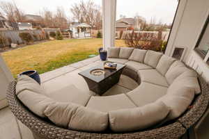 Fenced backyard with outdoor lounge area, an outbuilding, and a patio area