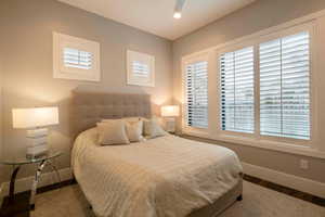 Bedroom with dark wood-type flooring and recessed lighting