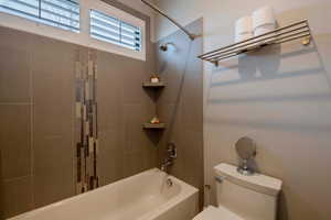 Full bath with bathtub / shower combination and toilet