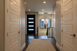 Foyer entrance featuring dark wood-type flooring and recessed lighting