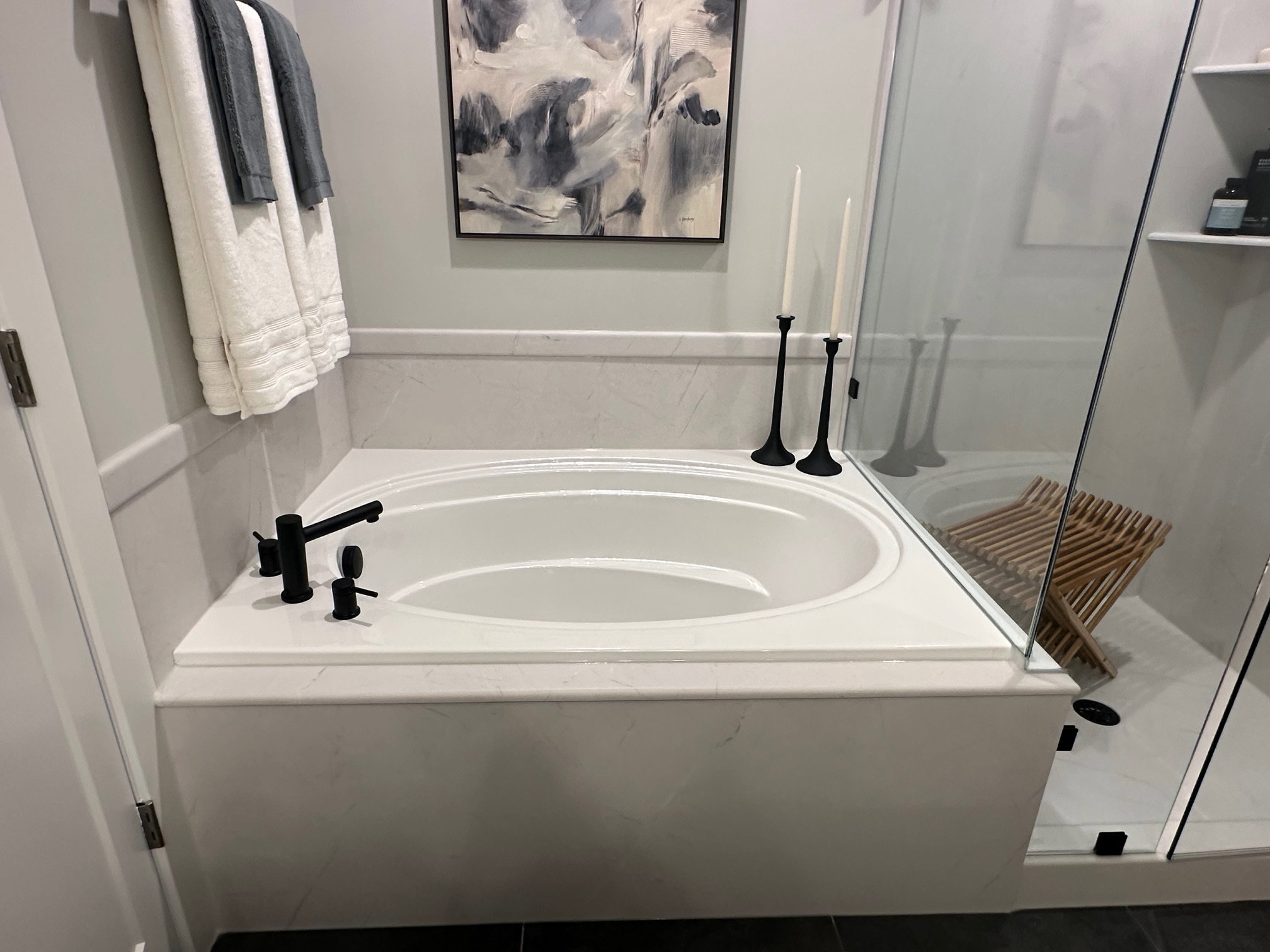 Full bath featuring a garden tub and a shower stall