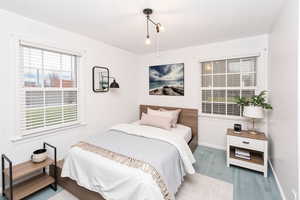 Bedroom featuring baseboards and carpet floors