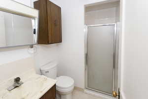 Bathroom with vanity and a shower stall