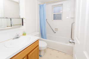 Full bathroom featuring vanity and shower / bath combo