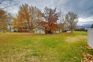 View of grassy yard featuring a mountain view