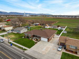 Aerial perspective of suburban area featuring a mountainous background