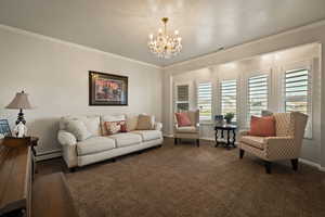 Living area featuring crown molding, carpet floors, a chandelier, a textured ceiling, and baseboard heating