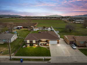 Aerial view at dusk of a mountain view and a view of countryside
