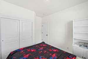 Unfurnished bedroom featuring baseboards and a closet