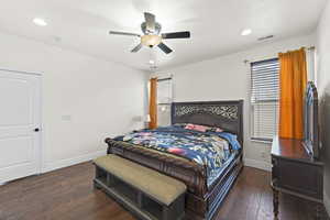 Bedroom featuring dark wood-type flooring, a ceiling fan, and recessed lighting
