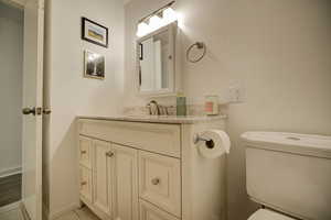 Main Bathroom featuring vanity and light tile patterned floors view 2