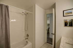 Main Bathroom featuring vanity, shower / bathtub combination, and light tile patterned floors