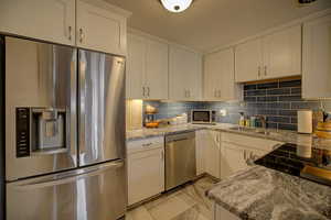 Kitchen with stainless steel appliances which are included