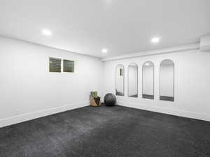 Workout room featuring recessed lighting
