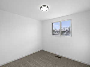 Bedroom featuring new carpet