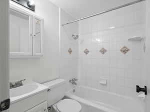 Bathroom featuring shower / washtub combination and vanity