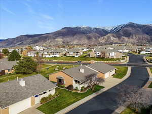 Arial View of mountain backdrop looking east. 5 min to WSU featuring nearby suburban area and look at that snow already!