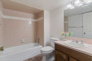 Full bath featuring retro ceramic tile in this spacious bathroom