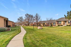 Surrounding community featuring spacious well cared for common area and a residential view