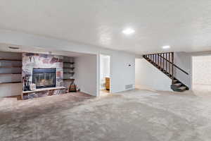 beautiful rock, wood burning fireplace for practicality and preparation